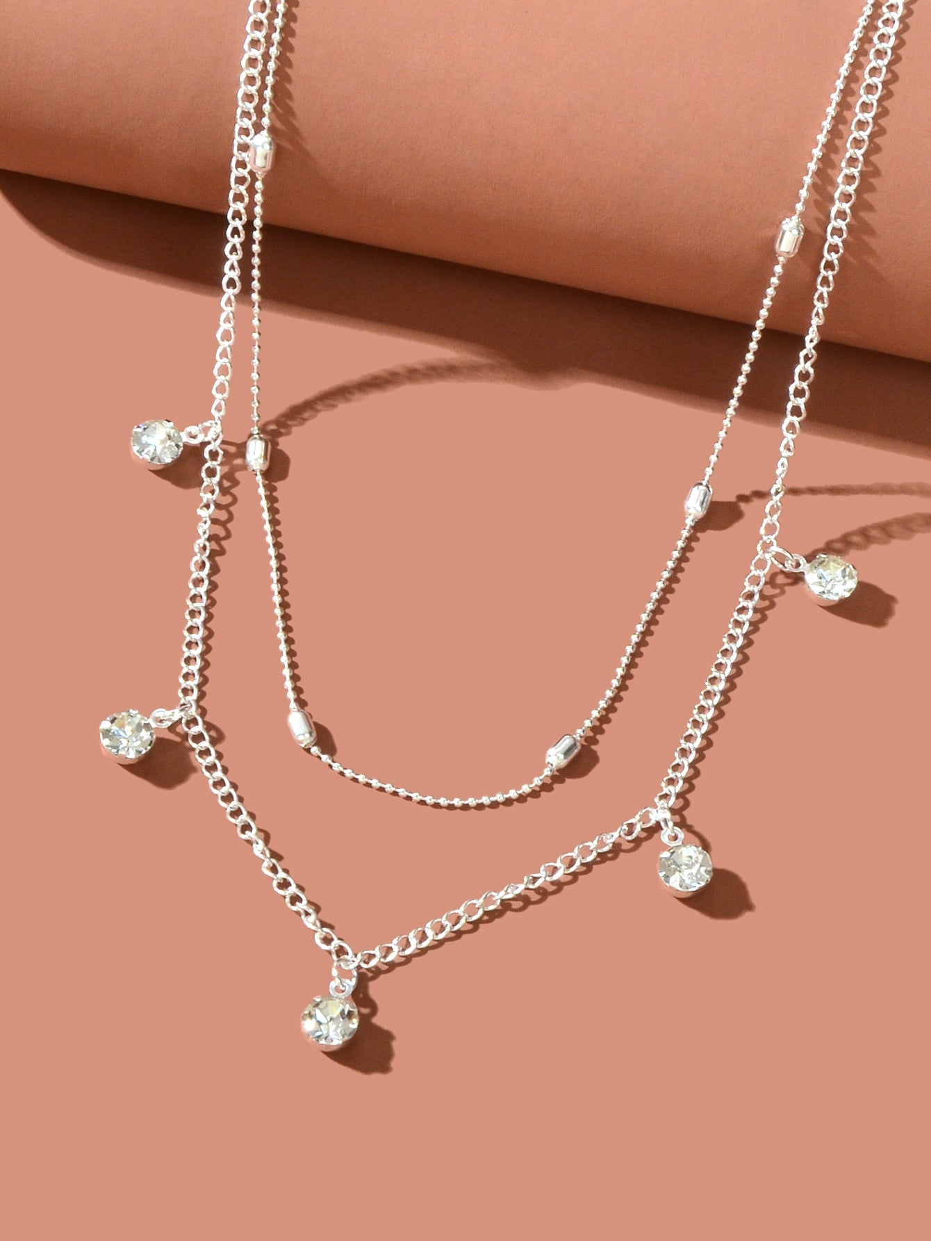 Adorn your neckline with the Dainty Adjustable Layer Gold Silver Chain Rhinestone Charm Clavicle Necklace, a delicate blend of elegance and charm. This layered masterpiece captures the essence of effortless beauty, inviting you to embrace your unique allure. Each shimmering rhinestone charm reflects your inner light, celebrating self-discovery and body positivity. Whether worn alone or layered, this necklace is a gentle reminder that elegance lies in the details.