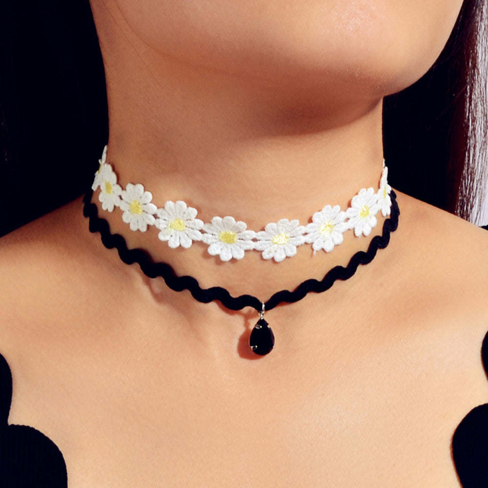 Embrace your individuality with the Gothic White Black Flower Tattoo Choker Necklace set. This exquisite collection invites you to express your bold self through its enchanting floral designs. Adjustable in length, each piece beautifully adorns your neck, celebrating your unique style and spirit. Perfect for those who seek to blend elegance with a touch of punk nostalgia, this choker set is a statement of self-discovery and empowerment. Wear it confidently, and let your true essence shine.