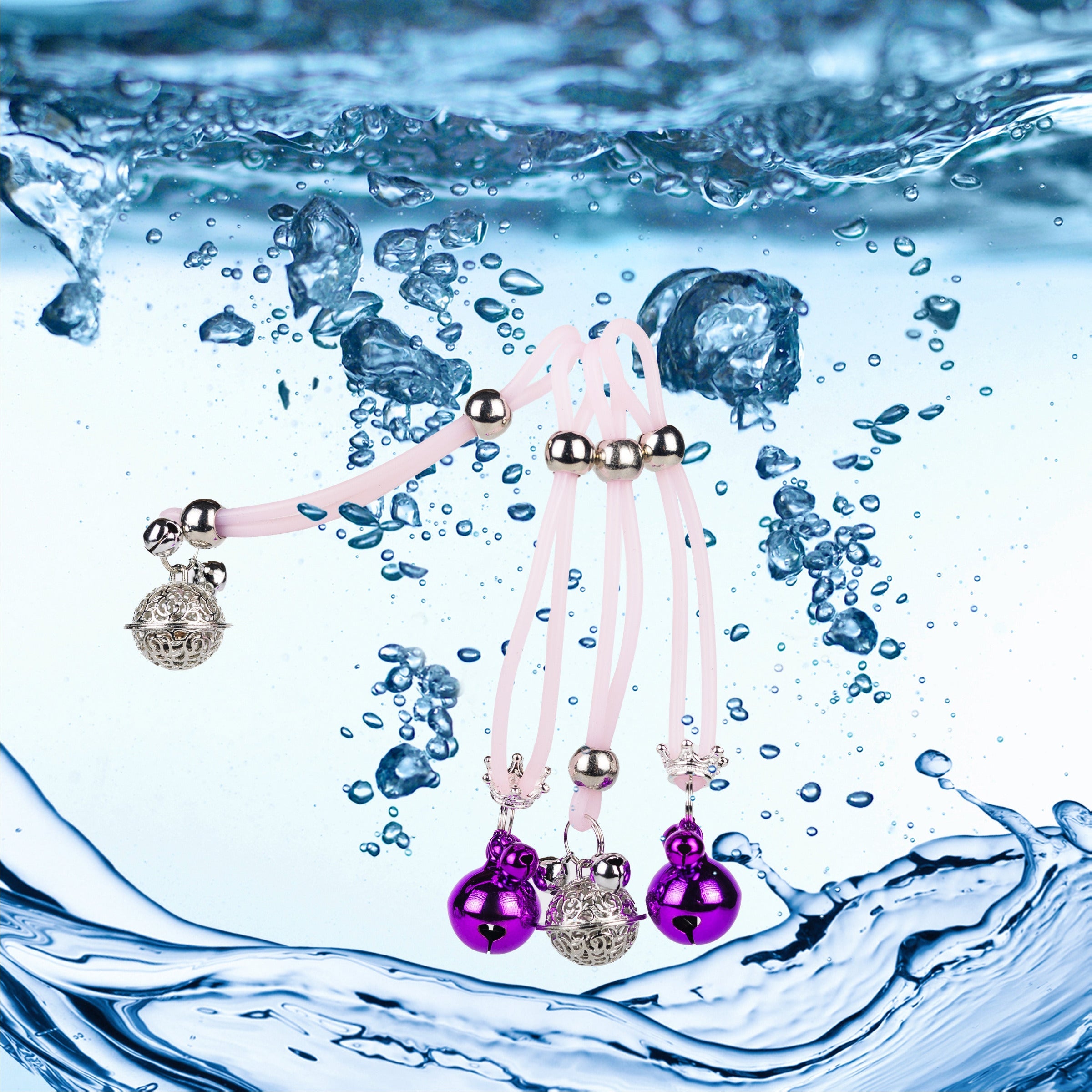 A pair of enchanting nipple gems in silver and purple, delicately suspended on a pink cord, inviting playful exploration and intimate allure.