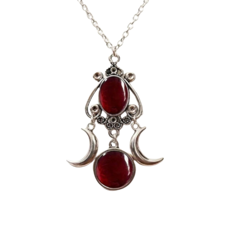Embrace your inner goddess with the enchanting Triple Moon Goddess Pendant Necklace. This exquisite piece, adorned with a captivating red stone and a delicate moon design, invites you to explore your unique style and express your individuality. Perfect for any occasion, it adds a touch of mystique to your ensemble, celebrating the beauty of self-discovery and confidence. Wear it as a reminder of your strength and elegance, allowing its charm to illuminate your journey.