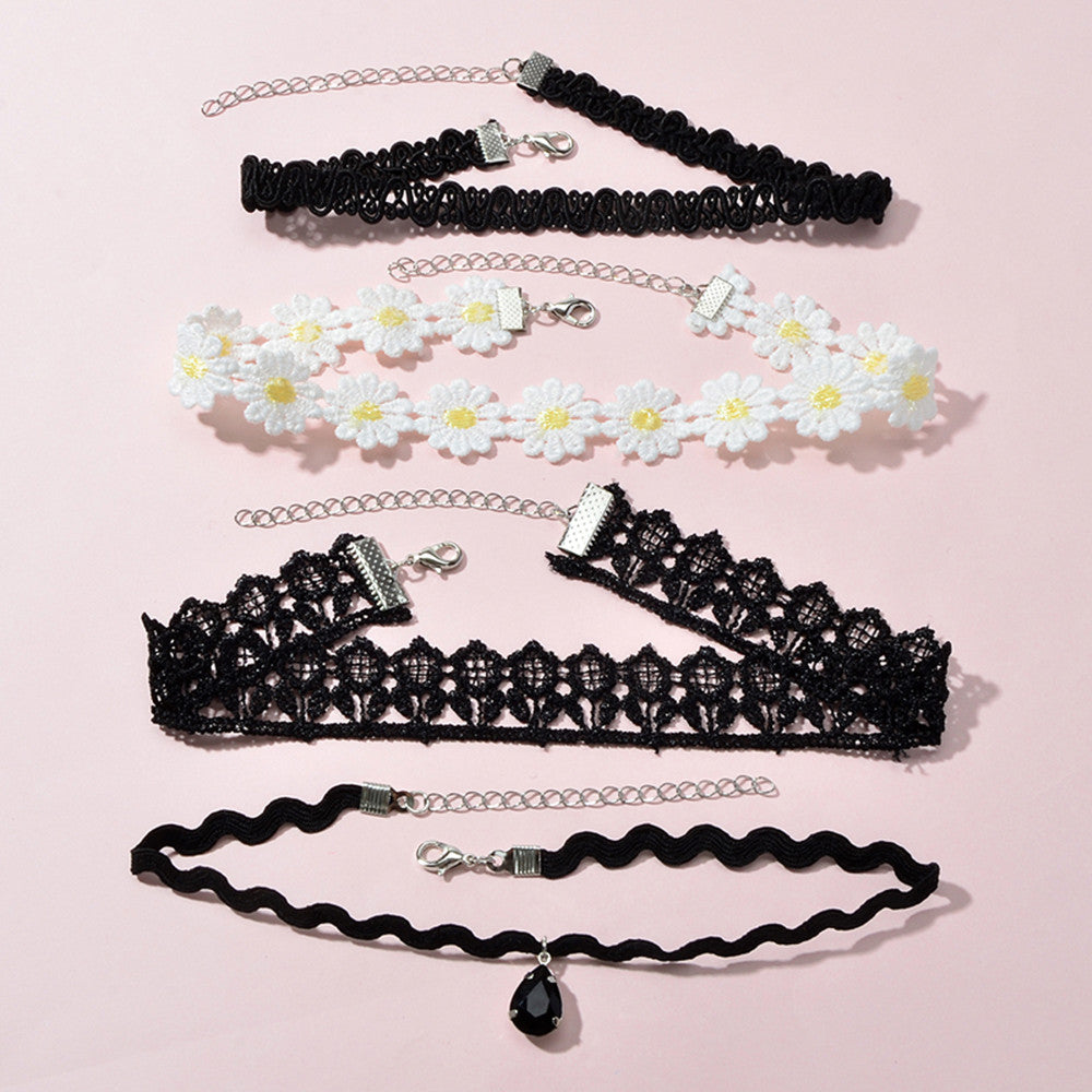 Embrace your individuality with the Gothic Floral Choker Set from Passion Beyond the Veil. This exquisite collection features four unique chokers, blending black and white floral designs that evoke a sense of bold self-expression. Adjustable in length, these pieces are perfect for layering or wearing alone, allowing you to showcase your personal style with confidence. Elevate your look and celebrate your beauty with this enchanting accessory, designed for those who dare to express their true selves.