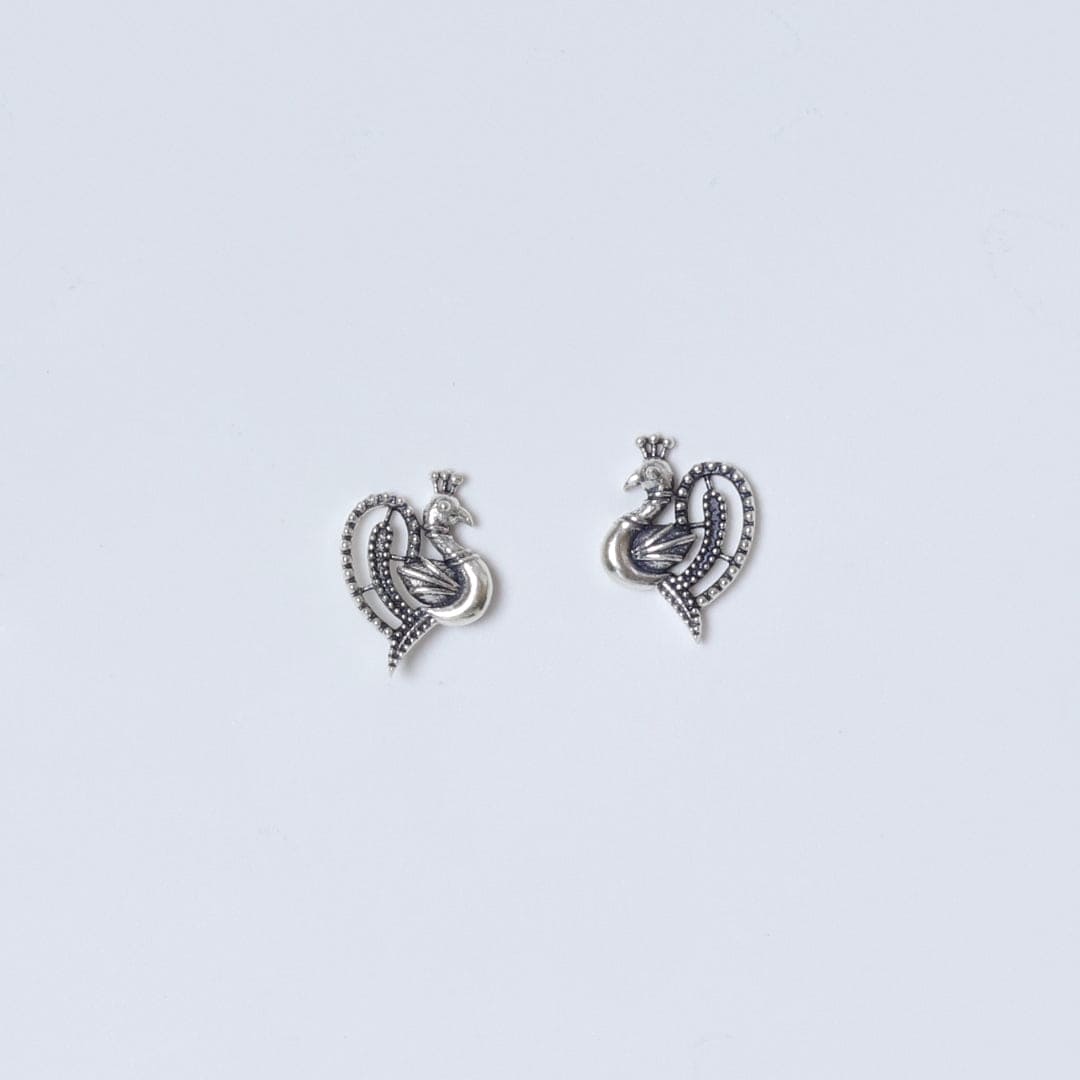 Discover the allure of our handcrafted peacock studds, where elegance meets everyday sophistication. Adorn your ears with these exquisite sterling silver pieces, designed to elevate your style and celebrate your unique beauty. Each stud reflects a timeless charm, perfect for both casual outings and special moments. Embrace your individuality and let these stunning earrings be a testament to your empowered self-expression.