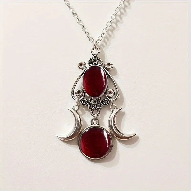 Embrace your inner goddess with the Charming Triple Moon Goddess Pendant Necklace. This exquisite piece, adorned in a captivating red hue, reflects the beauty of self-discovery and empowerment. Its elegant moon design serves as a reminder of the magic within you, perfect for enhancing any outfit while celebrating your unique journey. Wear it with pride and let your style shine.