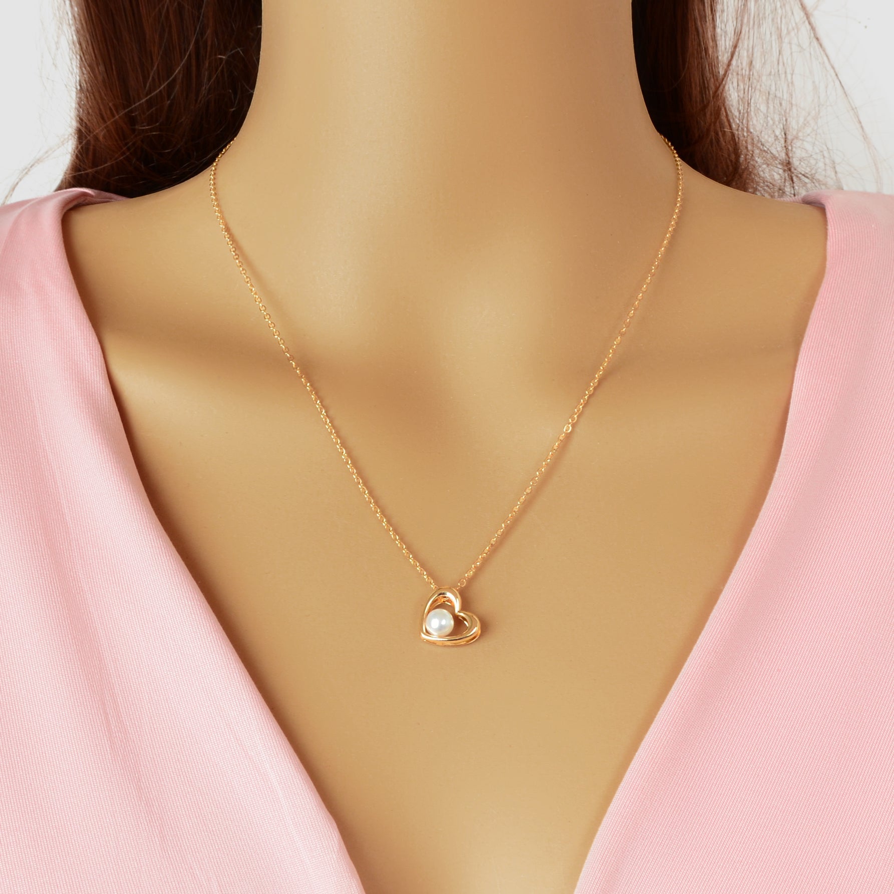 Embrace the elegance of self-expression with this Delicate Golden Chain Imitation Pearl Decor Heart Pendant Necklace. Perfect for daily wear, it adds a touch of romance to your office attire or a special gift for someone dear. Celebrate your unique beauty and let this necklace be a gentle reminder of love and connection in every moment.