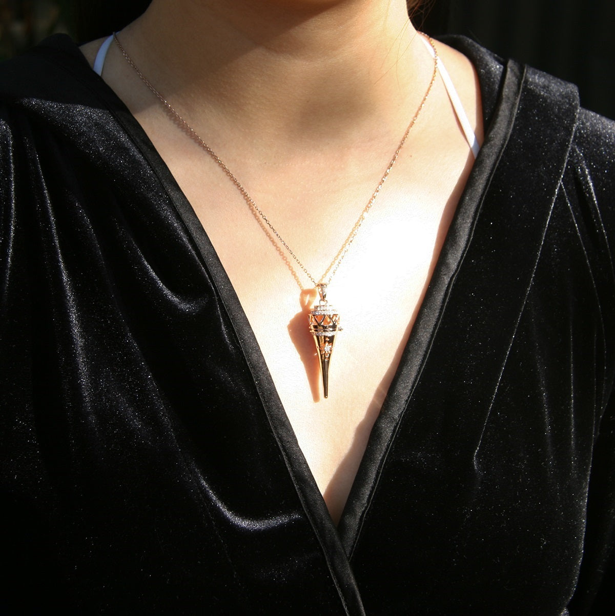 Embrace your essence with the Cone Aroma Necklace, a delicate 18K gold-plated pendant that carries your chosen essential oil. This elegant piece transforms your daily rituals into moments of serenity and empowerment, allowing you to breathe in tranquility wherever you go. Adorn yourself with this wearable sanctuary and let your spirit shine.