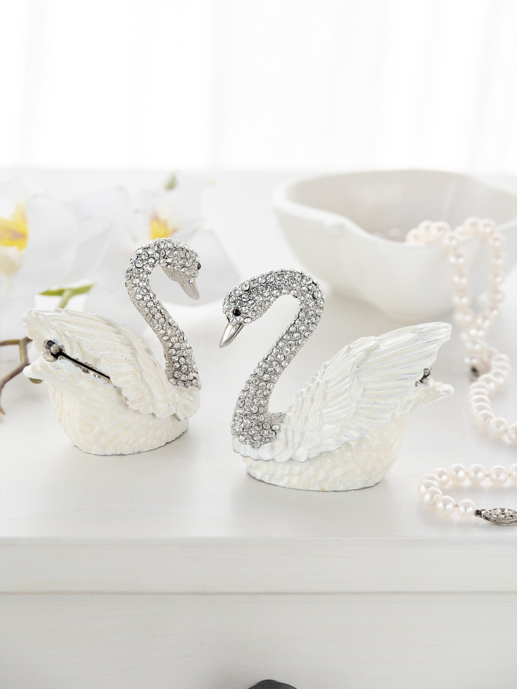 Embrace the allure of self-discovery with the Radiant White Swan with Crystals Neck Trinket Box. This exquisite piece captures the elegance of a swan, adorned with shimmering crystals that reflect your inner beauty. Handcrafted with care, it symbolizes grace and freedom, inviting you to celebrate your unique journey. Let this enchanting trinket box be a cherished addition to your collection, a reminder of the magic that lies within you.