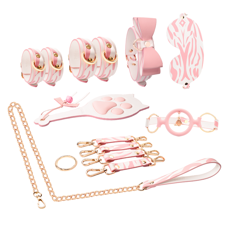 The Shaki BDSM Bondage Kit - Kitty Cat features playful pink and white cuffs, a charming collar, and a whimsical leash, inviting you to explore your sensual side with elegance and allure. Embrace your inner kitten and embark on a journey of discovery and connection, where every moment becomes a delightful adventure in intimacy.