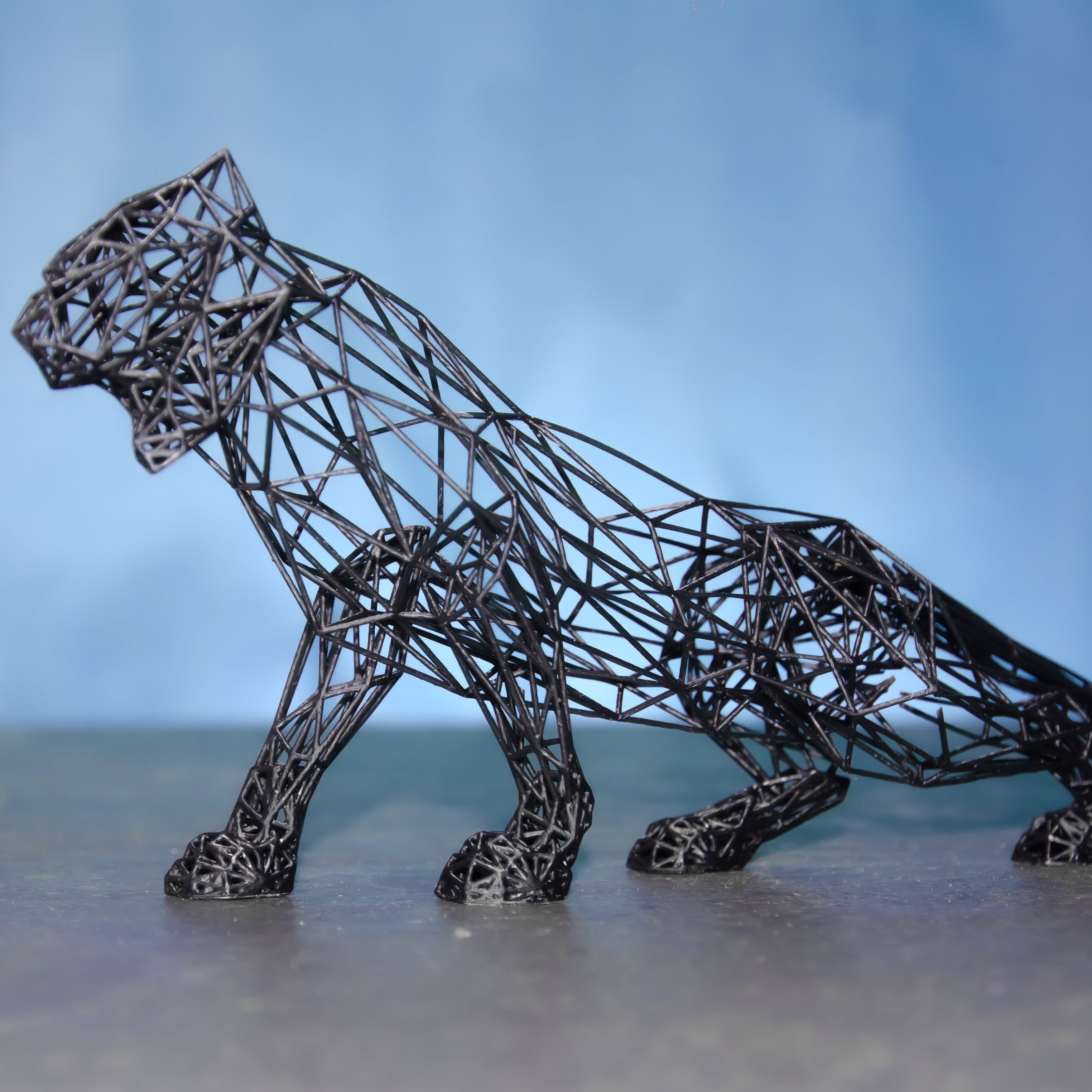 Embrace the allure of self-discovery with the Majestic Jaguar Sculpture. This exquisite piece embodies the wild elegance that resides within us all. Its intricate 3D wireframe design invites admiration and sparks conversation, making it a perfect addition to your sanctuary. Let this captivating artwork serve as a reminder of your own fierce beauty and strength, enhancing your space with sophistication and charm.